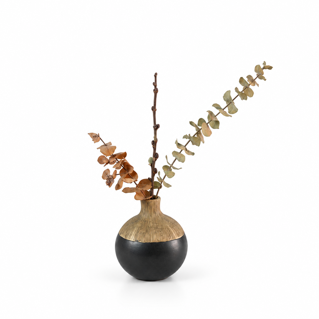 Exact black and gold vase arrangement with eucalyptus