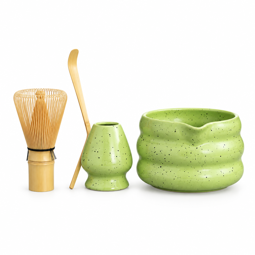 Four-piece matcha tea set centered on white