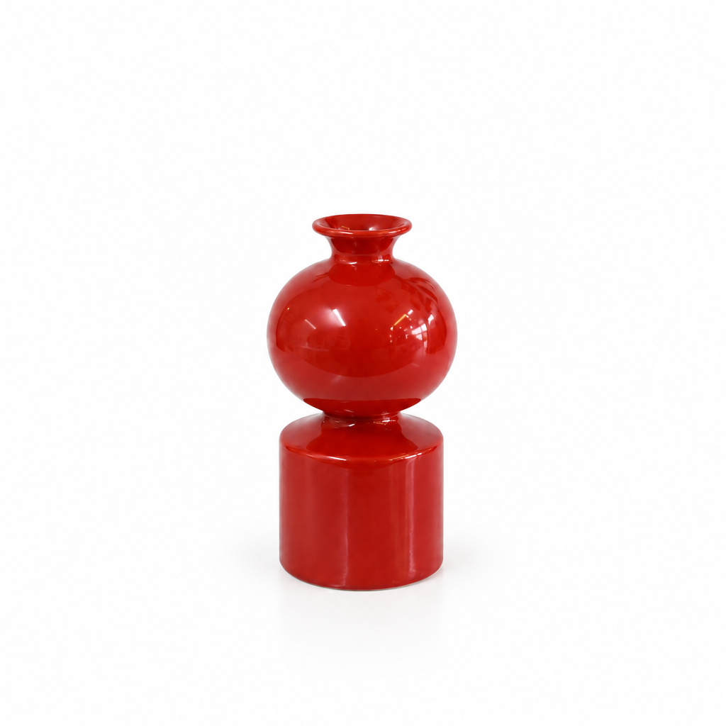 Glossy red sculptural ceramic vase without leaves