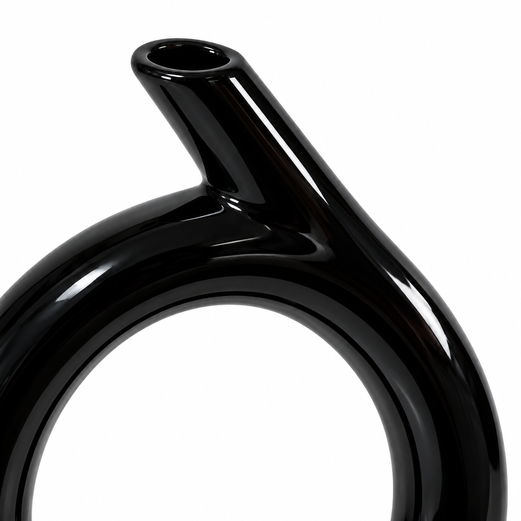 Close-up detail of the angled neck, raised inner ring, and glossy black ceramic finish