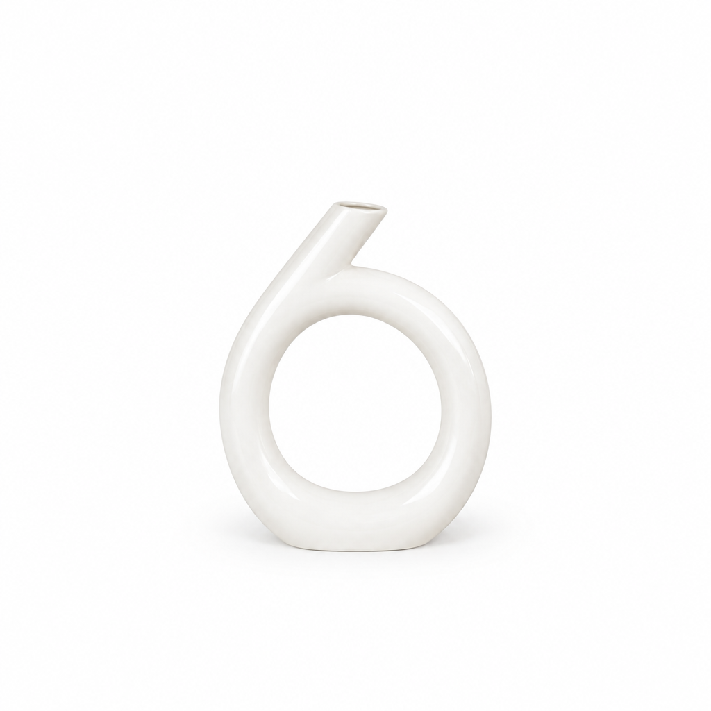 White circular sculptural ceramic vase shown smaller without flowers or stems