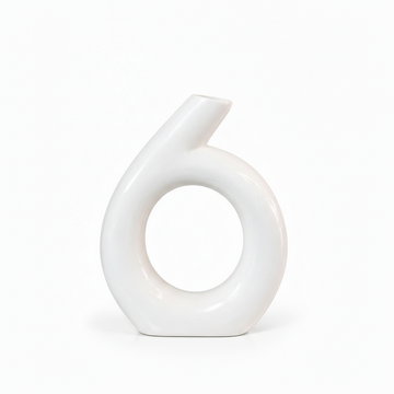 Modern white ring ceramic vase shown without flowers