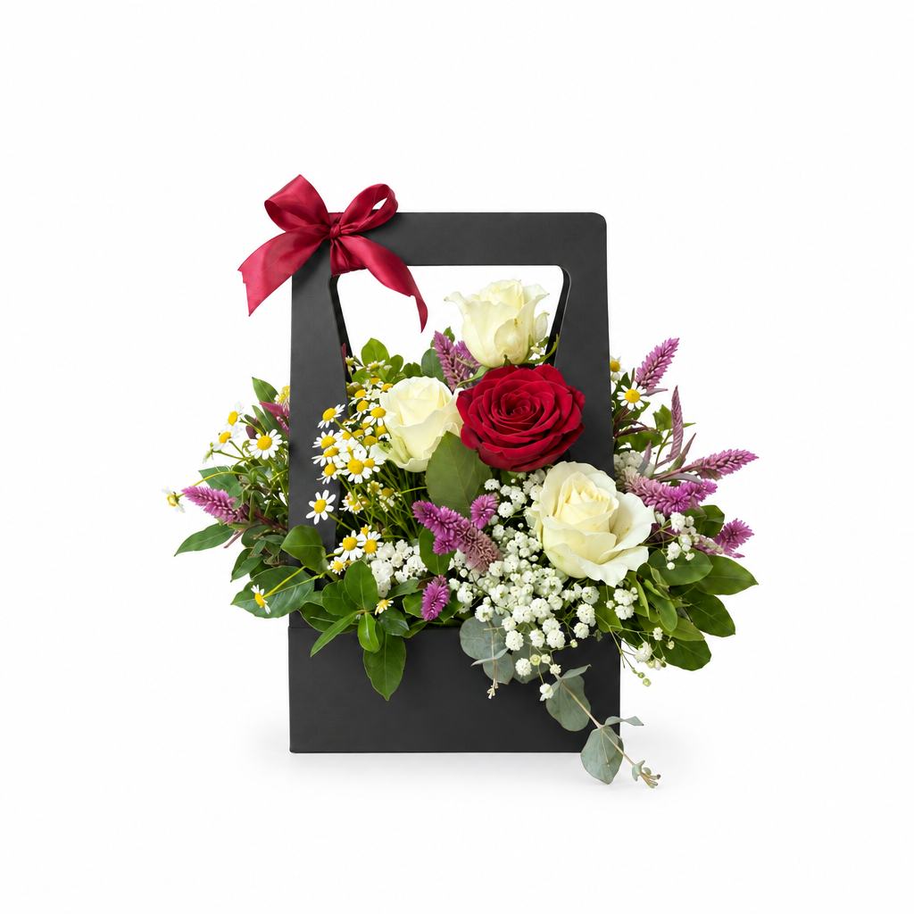 Red and white rose handbag flower arrangement on a white background