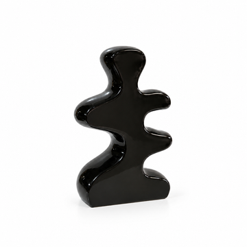 Abstract black cutout ceramic vase shown empty with generous white space