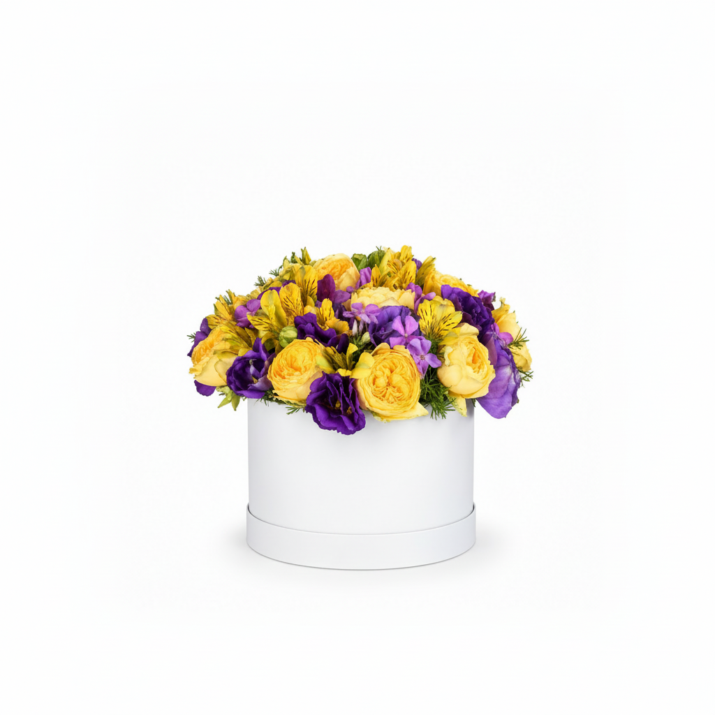 Golden yellow and violet flower arrangement in a white round box, slightly smaller and centered