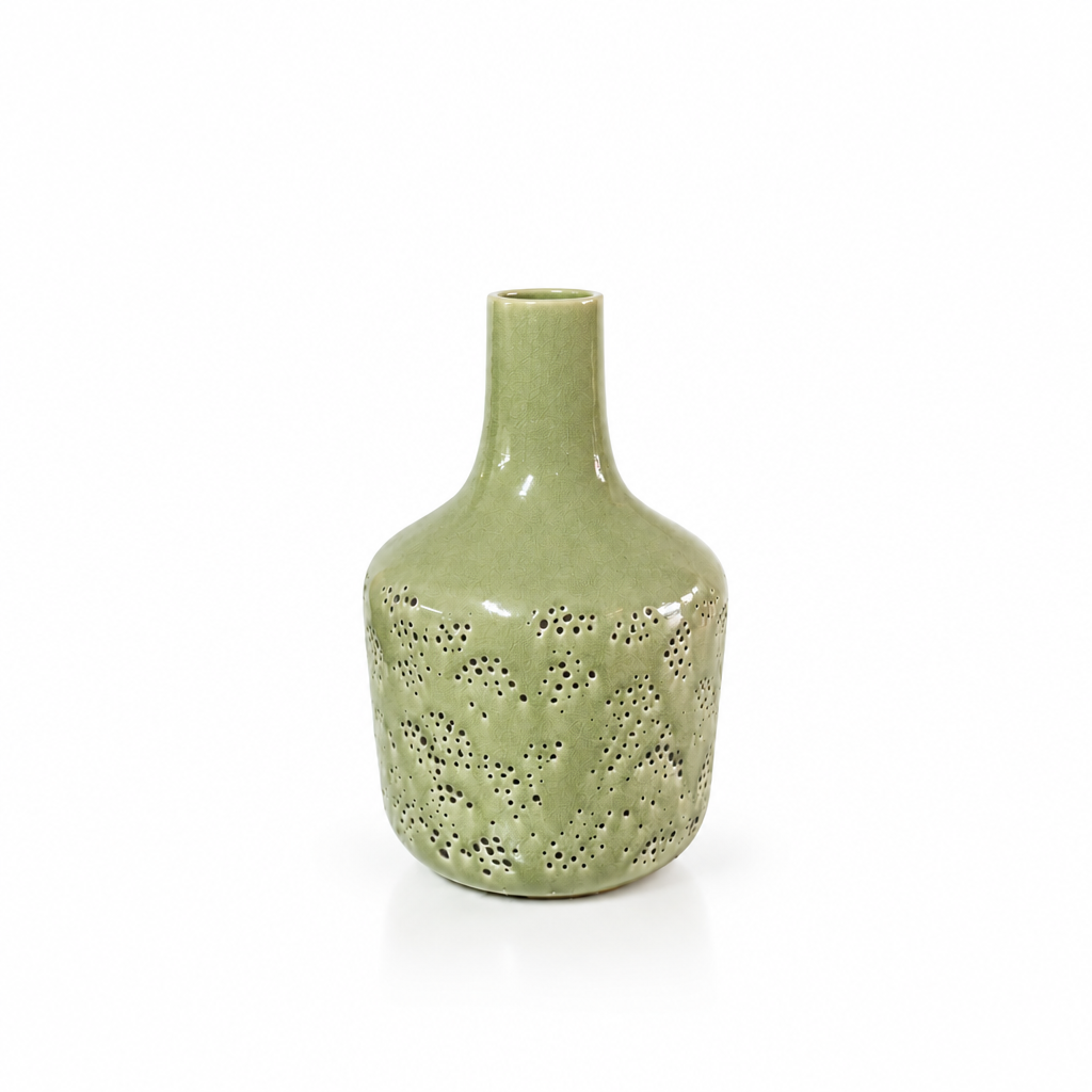 Sage green pierced ceramic vase shown empty with generous white space