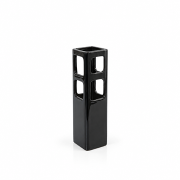 Tall black geometric cutout ceramic vase shown empty with generous white space