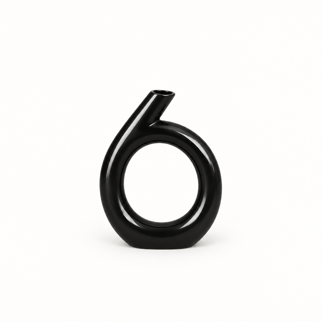 Glossy black circular sculptural ceramic vase shown alone on a clean studio background