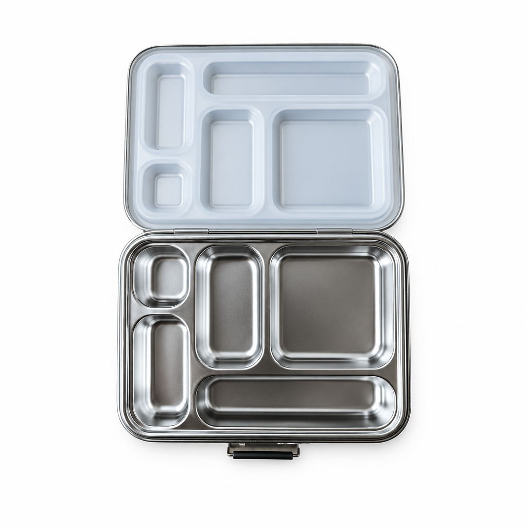 Open stainless steel lunch box centered on a white background